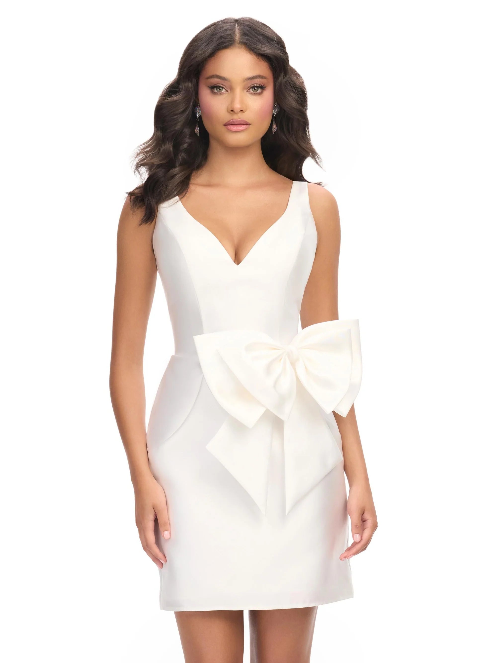 Chic mini dress featuring a plunging V-neckline, sleek silhouette, and an oversized statement bow at the waist for a touch of elegance and charm.