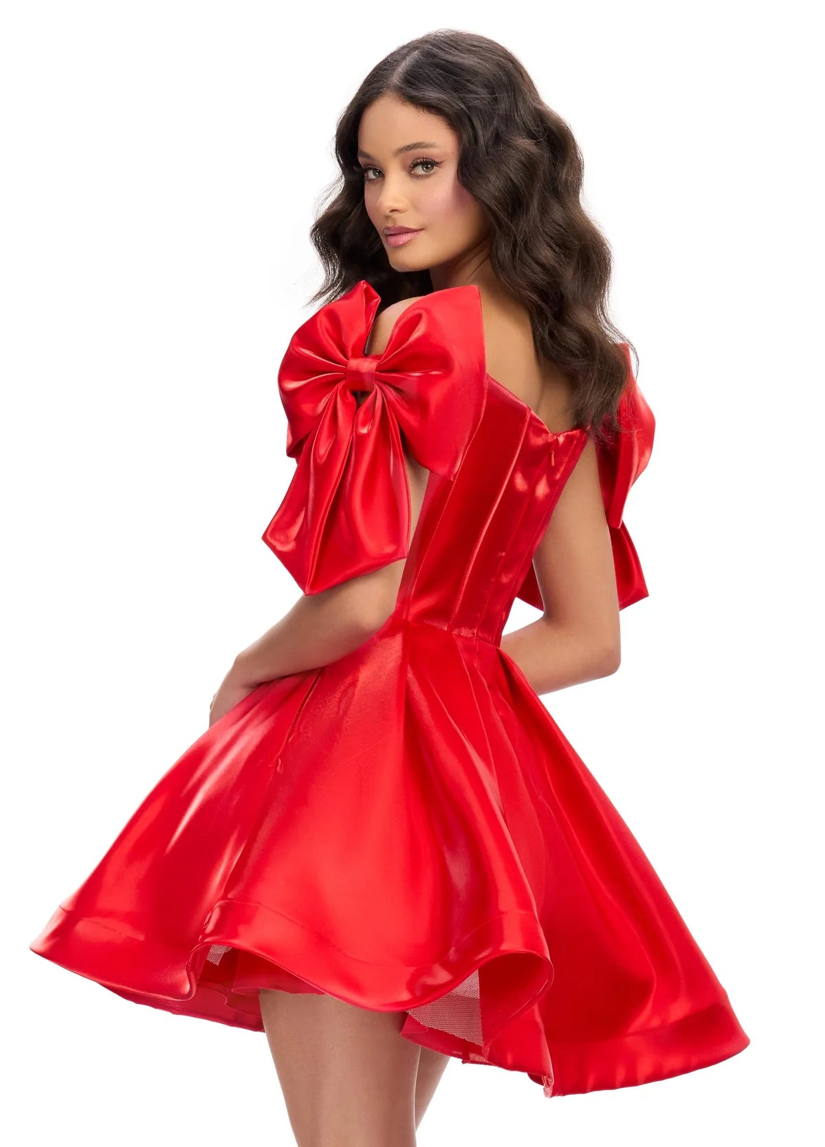 Back view of a striking red mini dress with a structured corset bodice, voluminous skirt, and oversized bow accents on the shoulders, perfect for a bold and playful statement look.