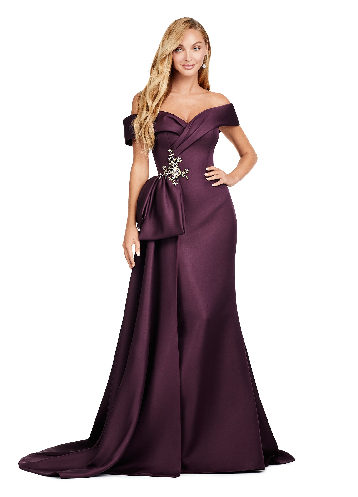 Regal wine-coloured evening gown featuring an off-the-shoulder neckline, elegant draped bodice, and statement side bow with intricate floral embellishment for added sophistication.