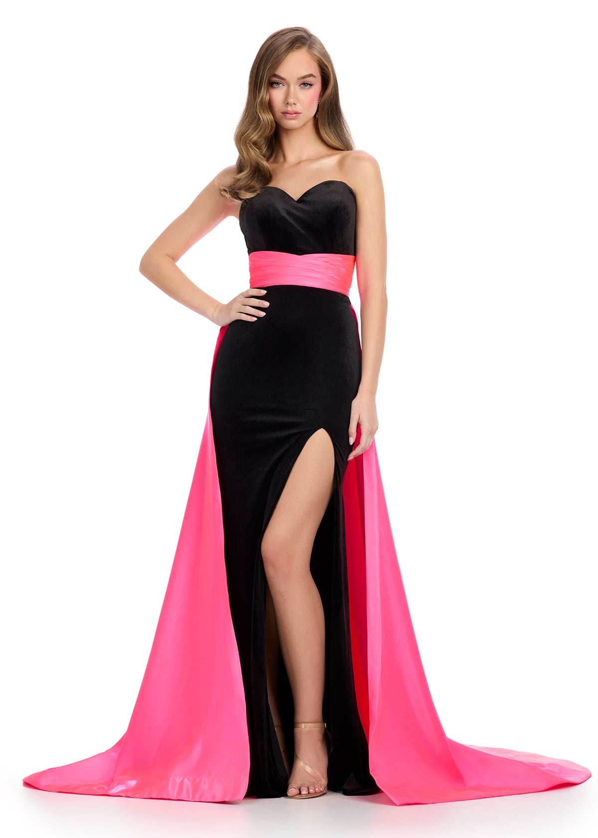 Strapless Evening Gown With Sweetheart Neckline, Side Slit, Contrasting Pink Sash And Train.







