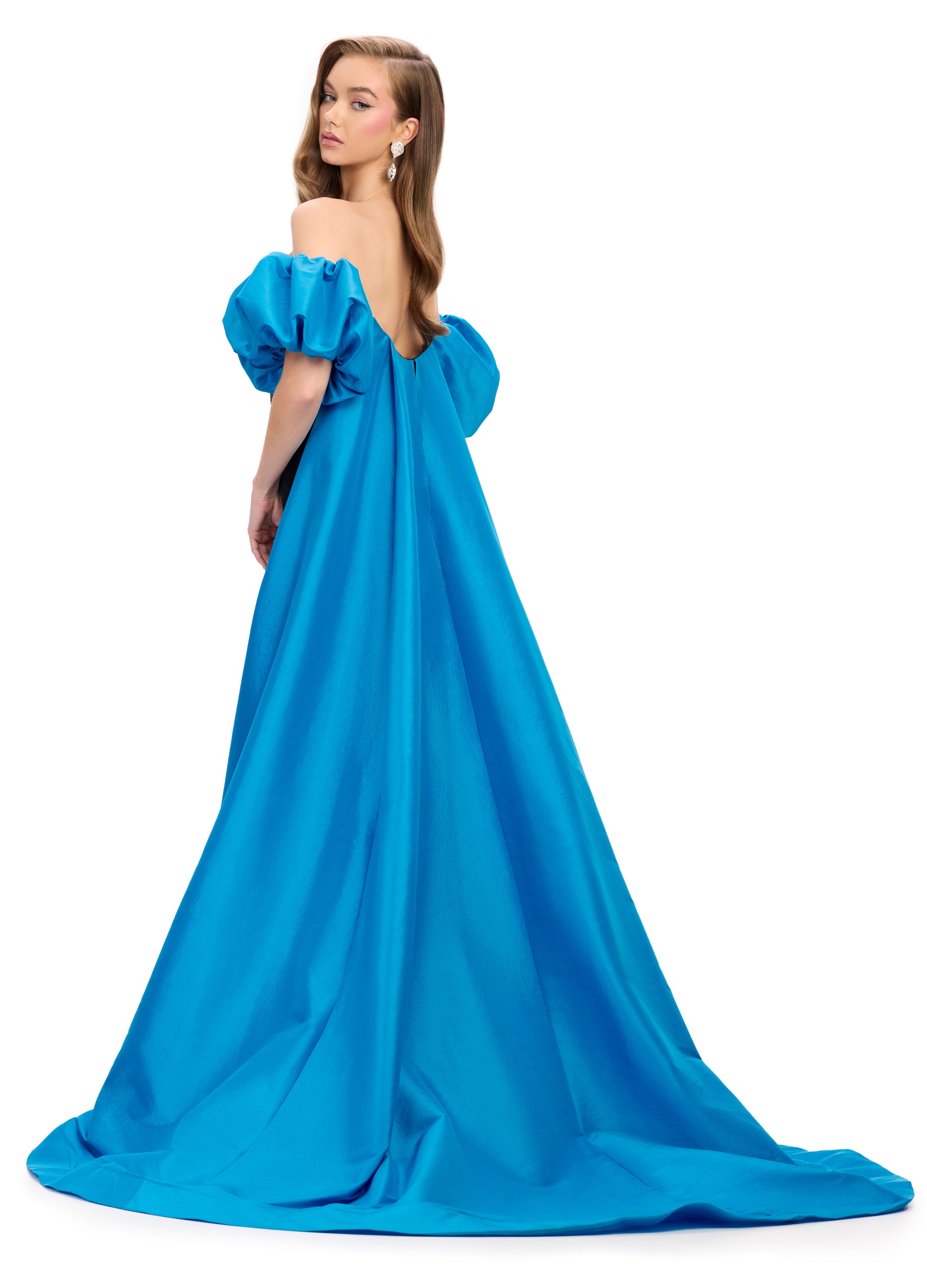 Back view - Elegant black strapless velvet gown with a fitted silhouette, bold blue off-shoulder puff sleeves, and a striking floor-length blue overskirt.