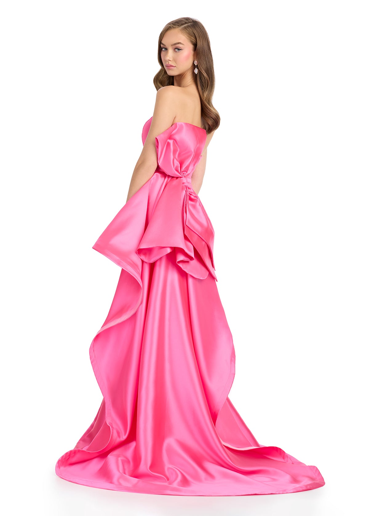 Back view - Elegant pink strapless gown with a sleek black silhouette, white waistband detail, and dramatic back ruffle cascading into a statement train.