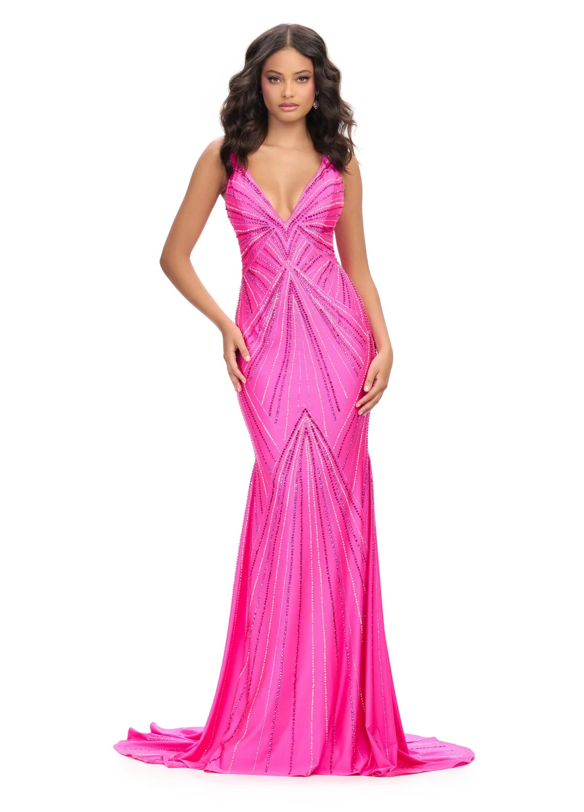 Close up video of an elegant fuchsia evening gown with a plunging V-neckline, adorned with shimmering geometric embellishments in silver and blue, creating a radiant, starburst effect for a strikingly glamorous look.