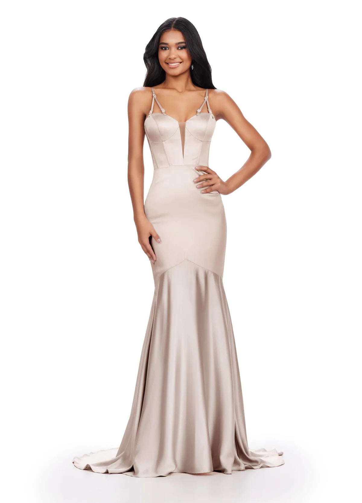 Close up vide of a striking nude satin mermaid gown featuring a plunging neckline, adjustable spaghetti straps with metallic detailing, and a flowing train, perfect for a glamorous evening or formal event.